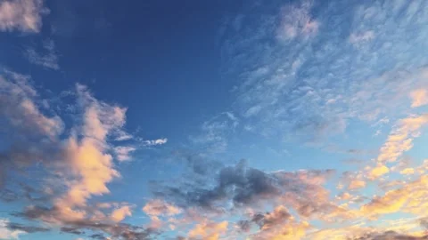 Golden Sunset Clouds Drifting Across Deep Blue Sky Stock Footage 345718307