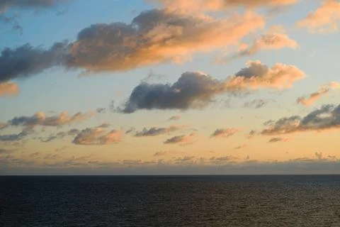 Golden Sunset Clouds Over Calm Ocean Horizon Near Saint Ives Cornwall Stock Photos