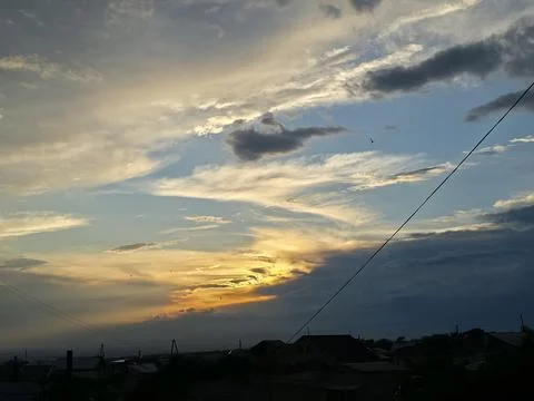 Golden Sunset With Dramatic Clouds and Power Line Foto stock