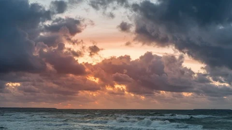 Golden sunset with dramatic cloudscape over the sea Stock Footage 118601022