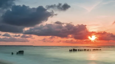 Golden sunset with dramatic cloudscape over the sea Stock Footage 161215361