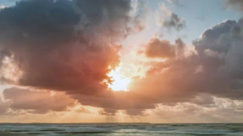 Golden sunset with dramatic cloudscape over the sea Stock Footage 193993790