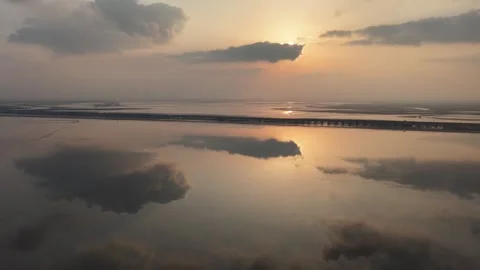 Golden sunset drone view over river wetlands and winter plains in Xinjiang Stock Footage 336591508