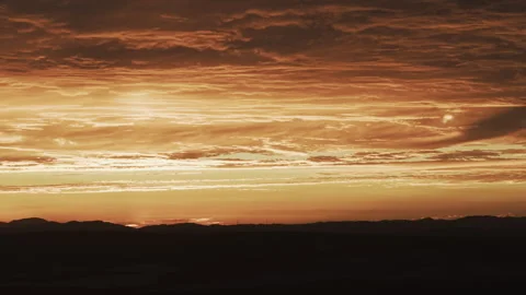 Golden Sunset Glowing Stratus Clouds Tracking Left Horizon 4K HLG Stock Footage 344015703