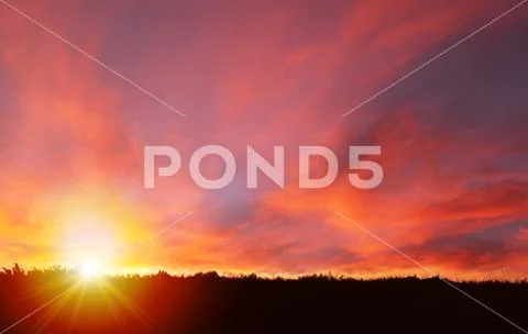 Golden Sunset Landscape With Lens Flare and Copy Space Stock Photos