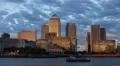 Golden Sunset Light Canary Wharf London Ship Passing Thames River Skyscrapers UK HD Footage
