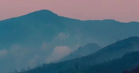 Golden Sunset Light Over Mount Bromo Volcano with Moving Clouds Stock Footage 329597180