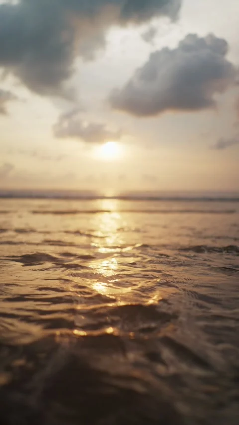 Golden sunset light reflecting on ocean waves 動画素材 340846275