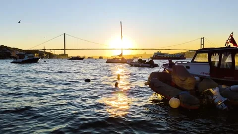 Golden Sunset over Bosphorus Bridge with Luxury Boats and Yachts in Istanbul Video stock 334636408