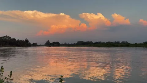 Golden Sunset Over Calm River With Beautiful Dramatic Clouds Sky Stock Footage 345288826