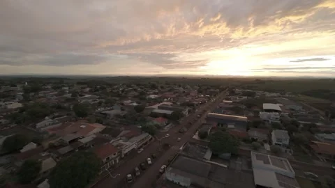 Golden Sunset Over a Charming Small Town – Aerial Drone Footage Stock Footage 306474175