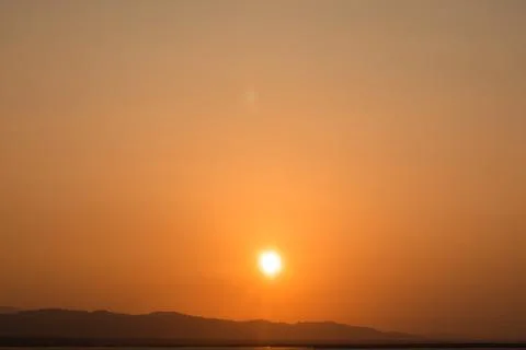 Golden Sunset Over Distant Mountains Stock Photos