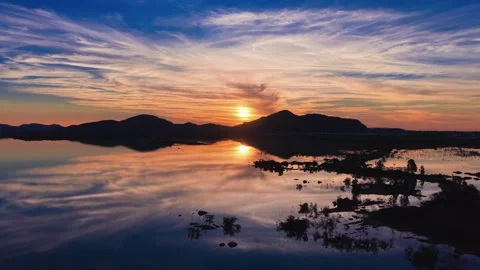 Golden Sunset Over Gaborone Dam With Flooded Causeway and Kgale Hill Stock Footage 343877121