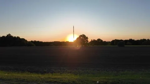 Golden sunset over meadows, a serene drive through nature's beauty Video stock 344821505