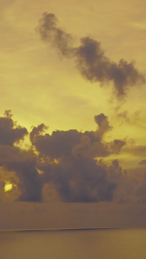 Golden Sunset Over Ocean with Dramatic Cloudscape Silhouette Stock Footage 344810960