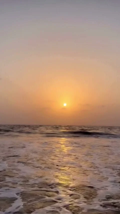 Golden sunset over ocean with sunlight reflection on water 4K Video stock 332791953