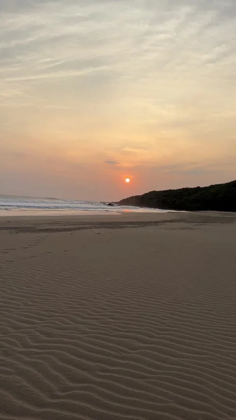 Golden Sunset Over Ocean Waves and Sandy Beach, Panning Shot, Vertical Stock Footage 324770408