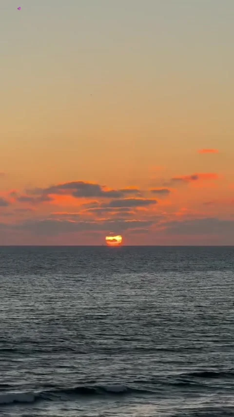 Golden Sunset Over Ocean Waves with Clouds Stock Footage 339584157