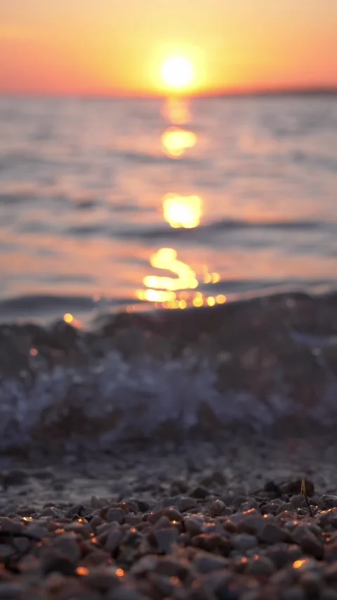Golden Sunset Over Pebble Beach With Soft Ocean Waves Stock Footage 337417577