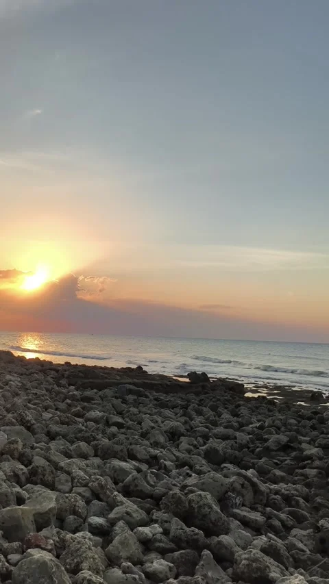 Golden Sunset Over Rocky Beach Vertical Stock Footage 340489751