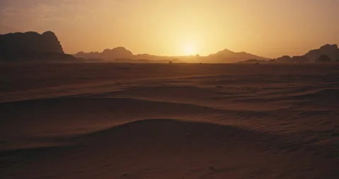 Golden Sunset Over Sand Dunes and Rocky Mountains in Wadi Rum Jordan Stock Footage 343962005