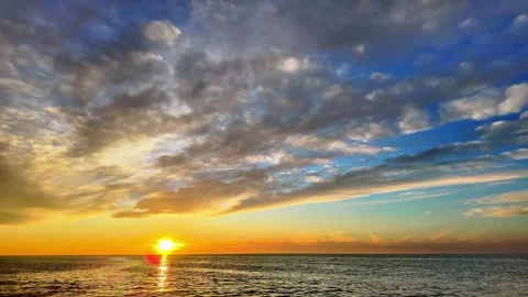 Golden Sunset Over Sea With Dramatic Clouds Vídeo Stock 345138990