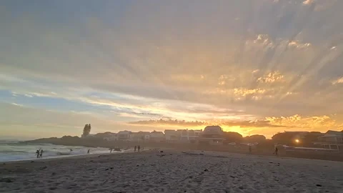 Golden sunset rays over a beach Stock Footage 335885663