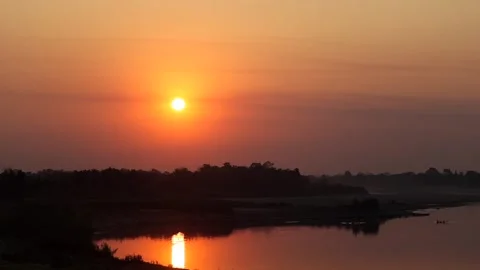 Golden Sunset Reflecting on Calm River Stock Footage 328529499