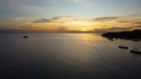 Golden sunset reflecting over tropical ocean bay 스톡 동영상 342575329