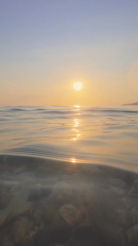 Golden Sunset Reflection on Calm Ocean Surface. Slow motion Stock Footage 312245401