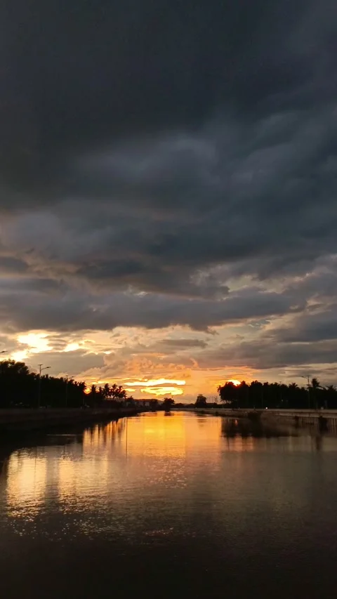 Golden Sunset Reflection on Calm River Stock Footage 325830272