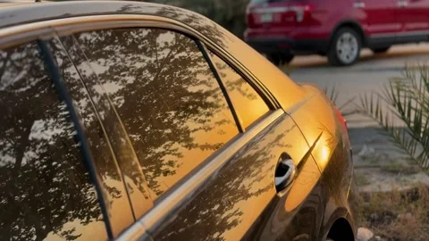 Golden sunset reflection on car window Stock Footage 334100427