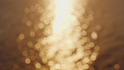 Golden Sunset Reflection Dancing Across Gentle Sea Waves Creating Warm Evening C Video stock 339018971