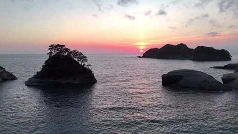 Golden Sunset Reflection on Ocean Dogashima Drone Pan Stock Footage 326081777