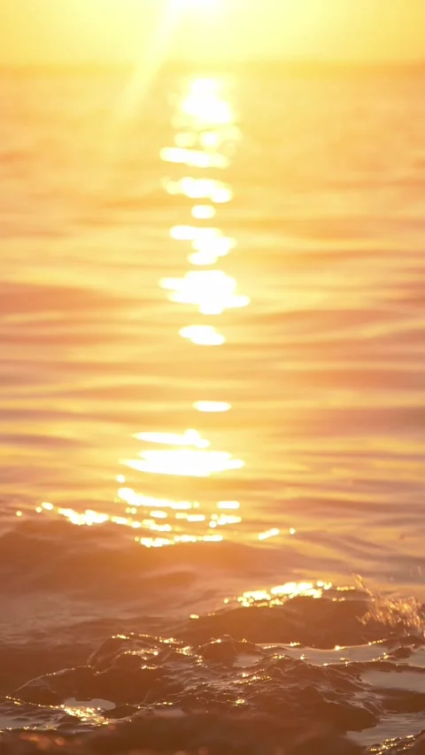 Golden Sunset Reflection on Ocean Water at Golden Hour With Soft Ripples Stock Footage 337413529