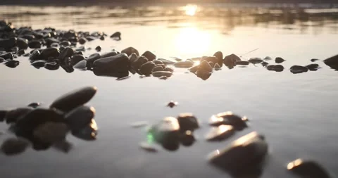 Golden sunset on the river. Low angle view of the river surface, 4k Stock Footage 142799626