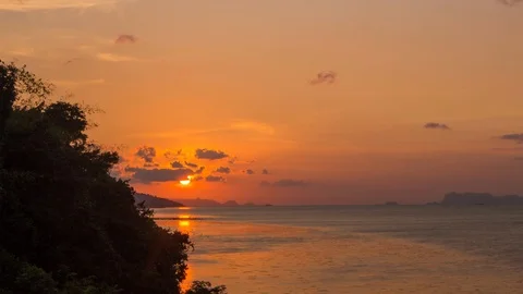 Golden sunset with running clouds time-lapse under sea Stock Footage 105369854