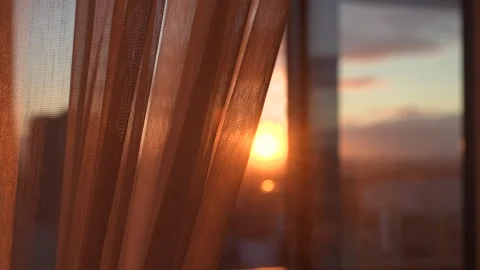 Golden sunset shining through sheer curtain window Stock Footage 325217104