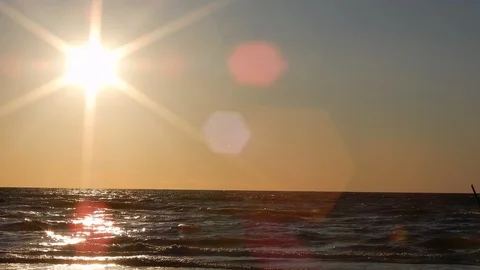 Golden Sunset With Sparkling Light Reflection In Ocean Water At Resort Stock Footage 127250314
