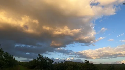 Golden Sunset Storm Clouds Moving in Stock Footage 231401121