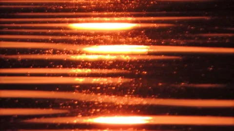 Golden sunset sunlight sparkling reflection on flowing seamless calm water wave Stock Footage 237471645