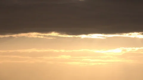 Golden sunset time lapse light rays coming from sky UK 4K Stock Footage 115944849