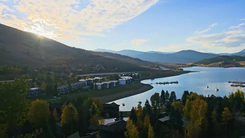 Golden sunset view over Dillon Reservoir in Colorado, with bright sun flare Stock Footage 345249500