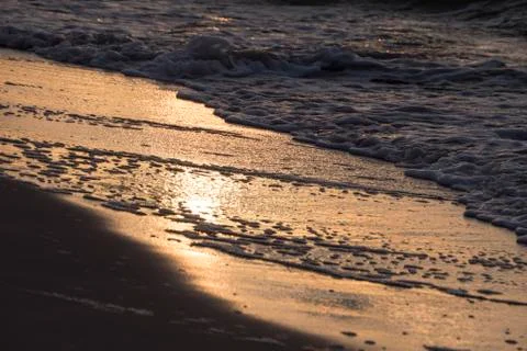 Golden sunset waves. Stock Photos