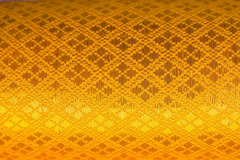 Golden textile pattern background. Stock Photos