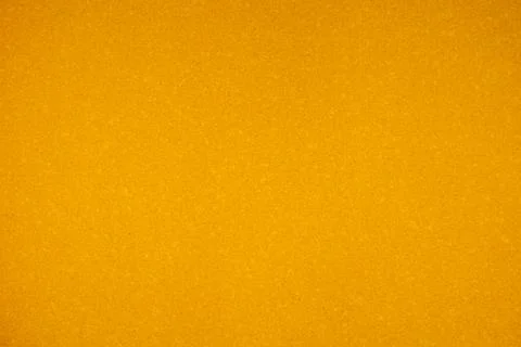 Golden textured abstract surface background with uniform granular material .. Stock Photos