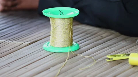 Golden thread spool Stock-Footage 221526562