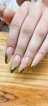 Golden tip nails Stock-Fotos