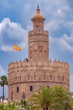 The golden tower of Torre del Oro on a sunny day. Seville. Stock Photos
