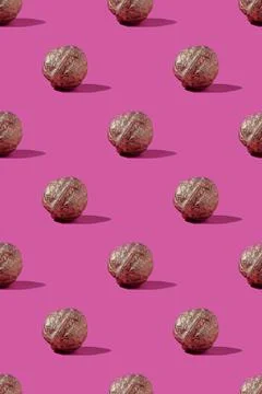 Golden walnuts in pattern Stock Photos